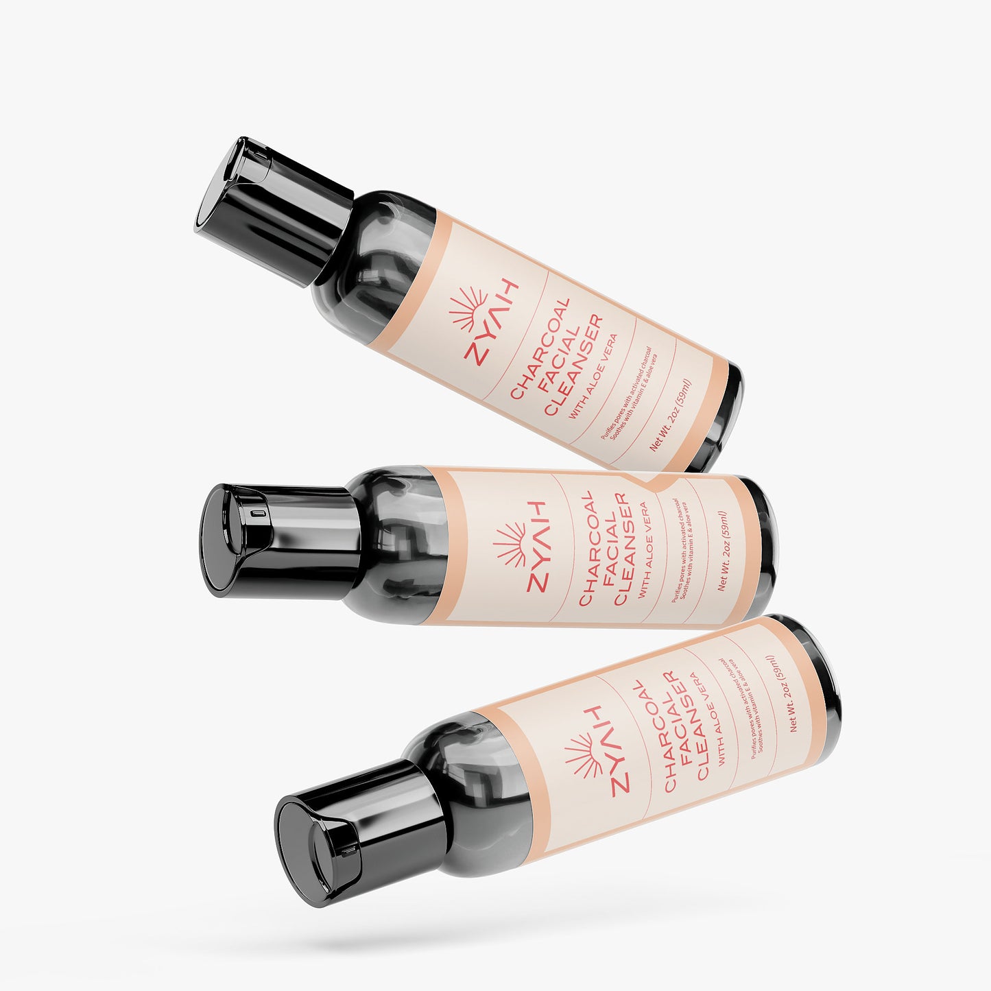 Three bottles of Zyah Charcoal Facial Cleanser natural