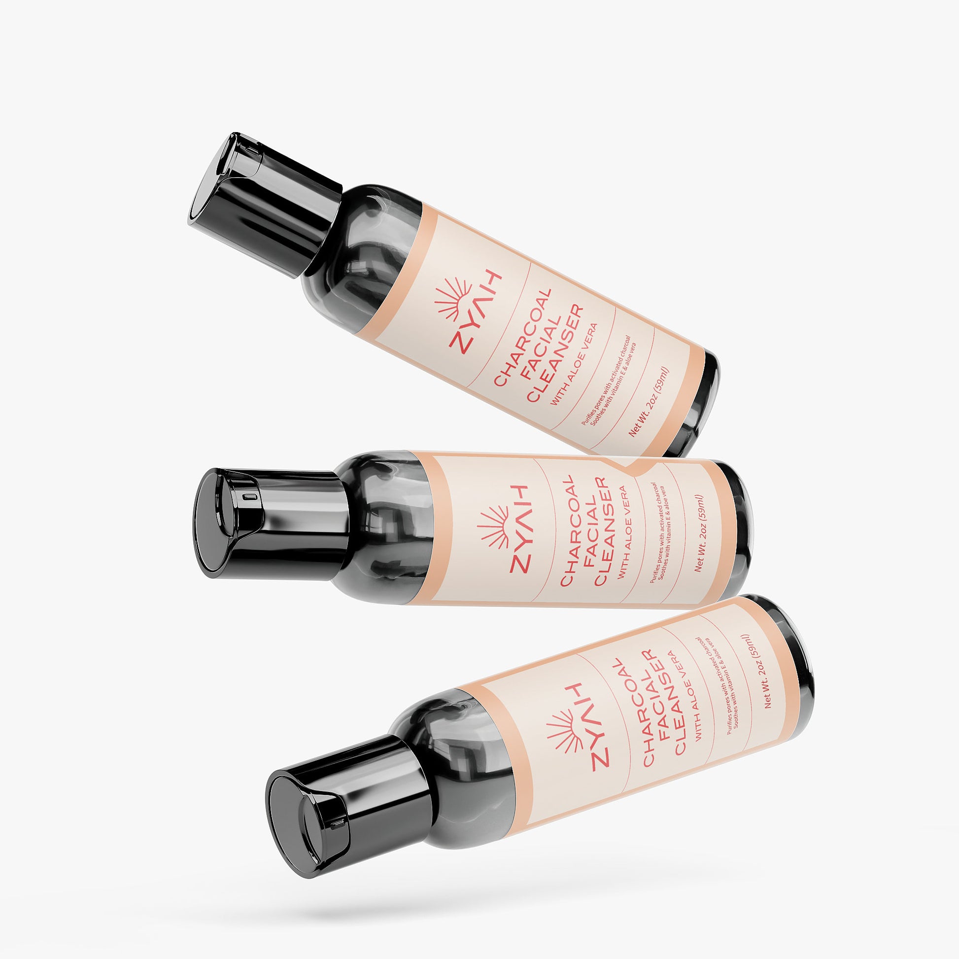 Three bottles of Zyah Charcoal Facial Cleanser natural