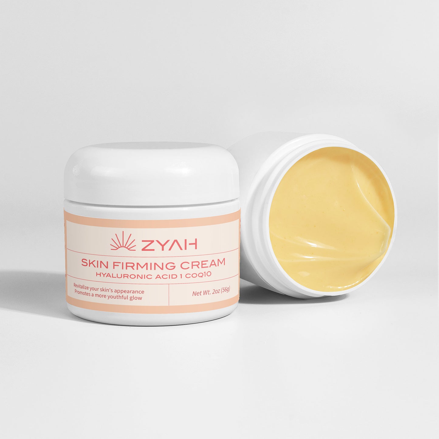 Zyah skin firming cream jar for Glowing Skin with lid open on a light gray background