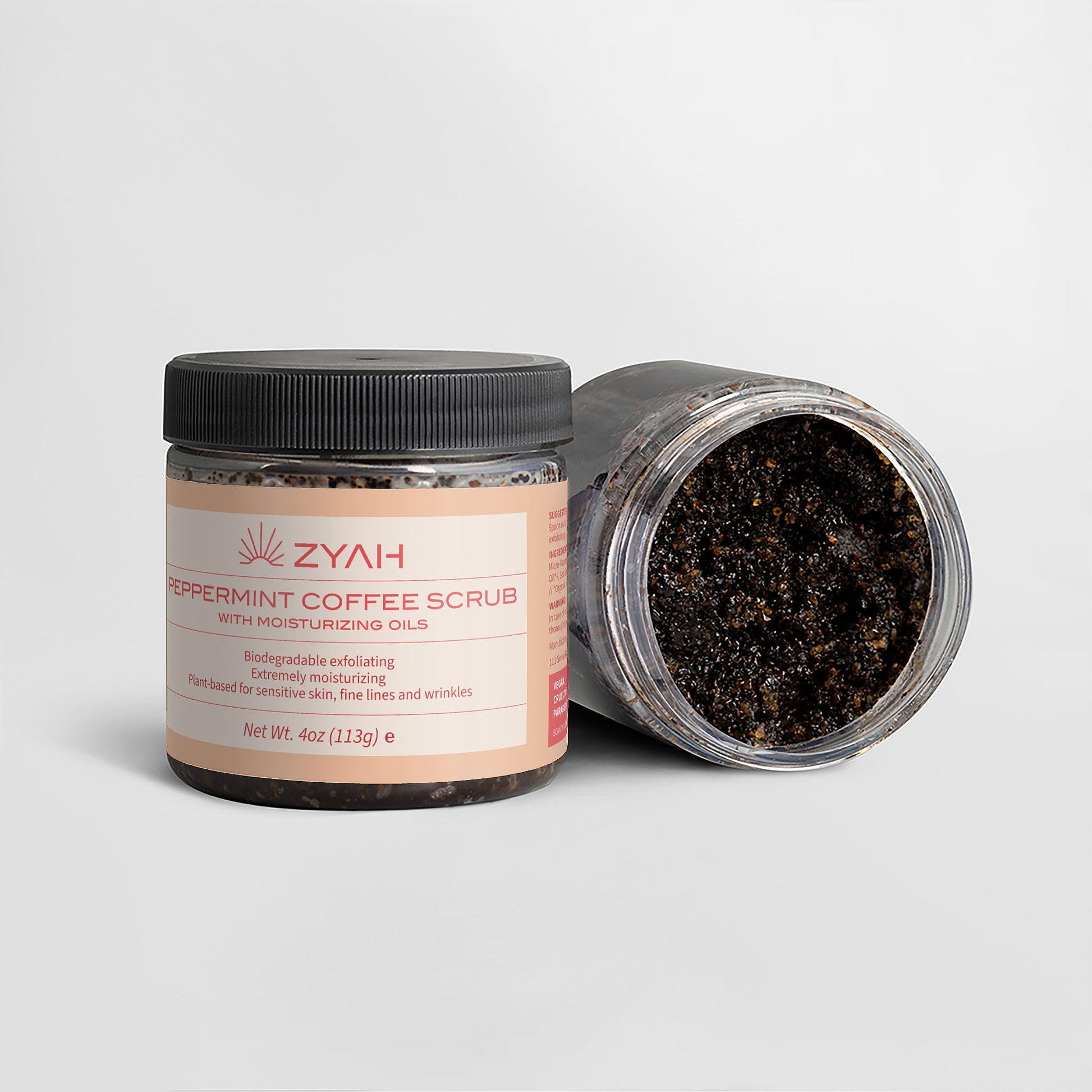 ZYAH Peppermint Coffee Scrub Botanical Skincare jar with open lid on a light gray background