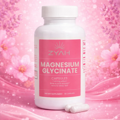 Bottle of ZYAH Magnesium Glycinate capsules on a pink floral background