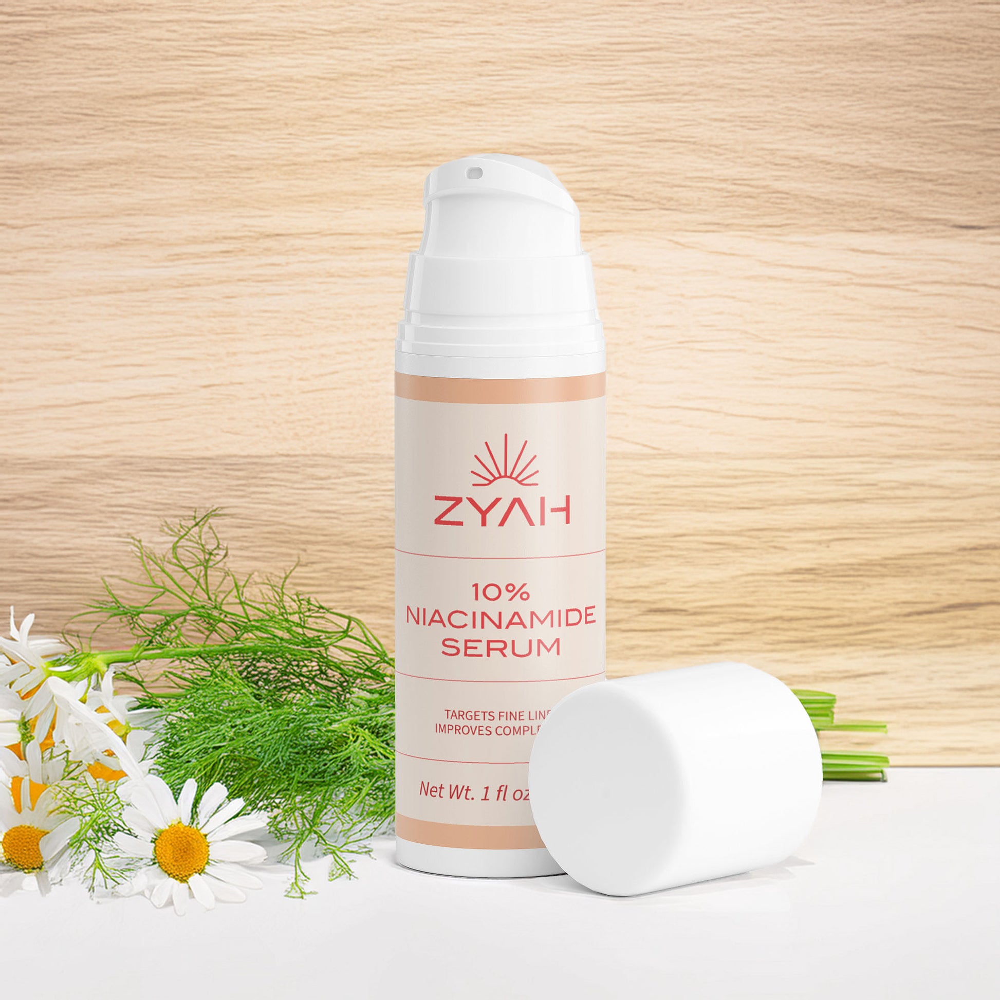 Zyah 10% Niacinamide Serum bottle with flowers on a wooden background